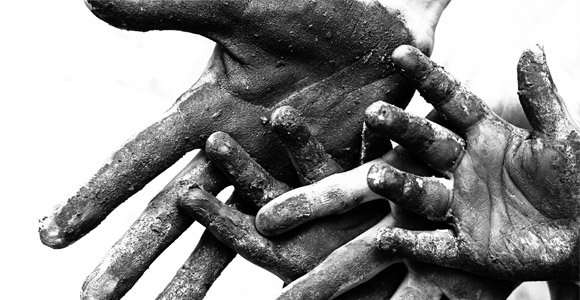 Dirty hands signifying forced labor and child labor