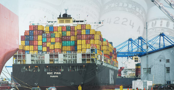 Cargo ship with money faded in background